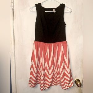 Gray high neck dress with a coral and white flowy chevron skirt